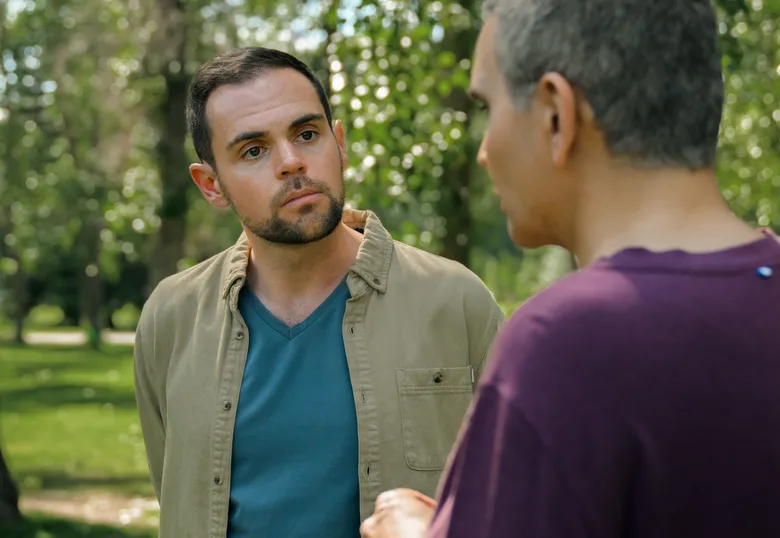 Michael Snow in conversation with a client in a Calgary park